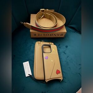 Bandolier Beige Phone Case with Heart Accents 14 pro max NWT